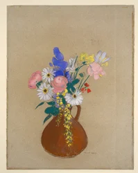 茶色の陶器の花瓶に生けた花束