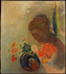 花瓶の花を持つ女性