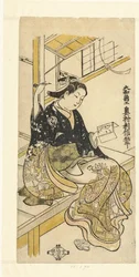 手鏡を持つ女性