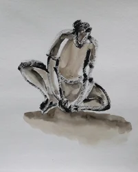物思いにふけるしゃがんだ人物