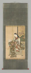 扇子を持つ座る女性