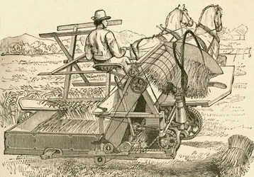 Uma máquina de colheita, puxada por cavalos, que amarrava as roldanas de milho mecanicamente, usada no final do século XIX. De El Museo Popular publicado Madrid
