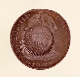 スペインの銀貨（8レアル）：チャールズ3世の時代（1759〜1788年）。1777年、1787年のカウンターマーク付き。直径3.9cm ナポリ、考古学博物館