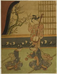 付き添いがボールで遊んでいるのを見守る花魁