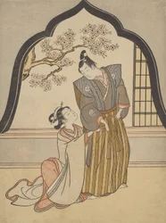 窓辺で着替える恋人たち