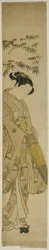 雪の中を歩く若い女性