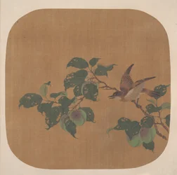 鳥と開花木の枝。