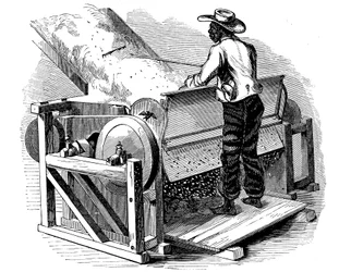 裸足の黒人労働者が操作する綿花洗浄用のソー・ジン、アメリカ南部、1865年