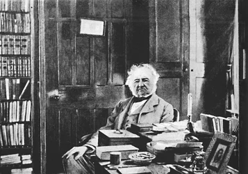 ウィリアム・グラッドストーン-研究テーブルc1925に座った壮大な老人