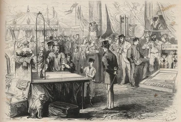 フォンテーヌブローの晩餐会に参加した皇太子ユージン・ルイ・ジョセフ（1856-1879）。紐で吊るされたボールの力を借りて、人形を脱力させようとしている。"The Universe illustrious "のエングレーヴィング
