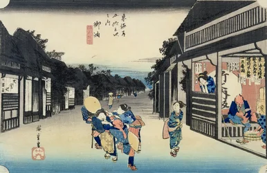 Goyu：「東海道の53駅」シリーズからの旅人を誘うウェイトレス、1833-34（カラー木版画）を公開