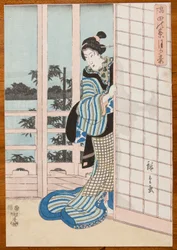 ベランダに立つ女性