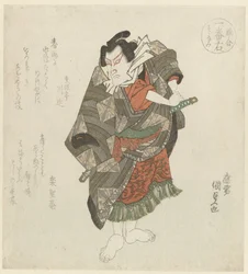 立っている男が剣を握っている