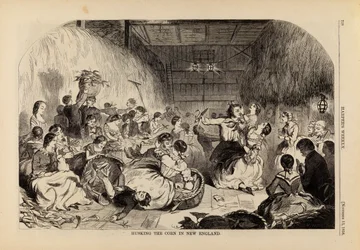 ニューイングランドでトウモロコシを籾摺りする（1858年11月13日号『Harper