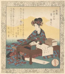 机に座って頌歌を作る中国の女性